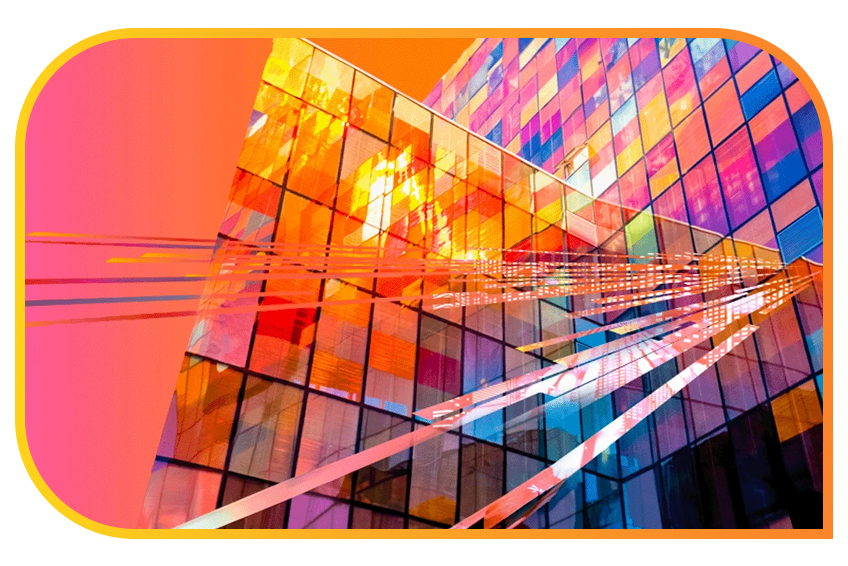 Colorful glass facade of a modern building with geometric patterns and reflections